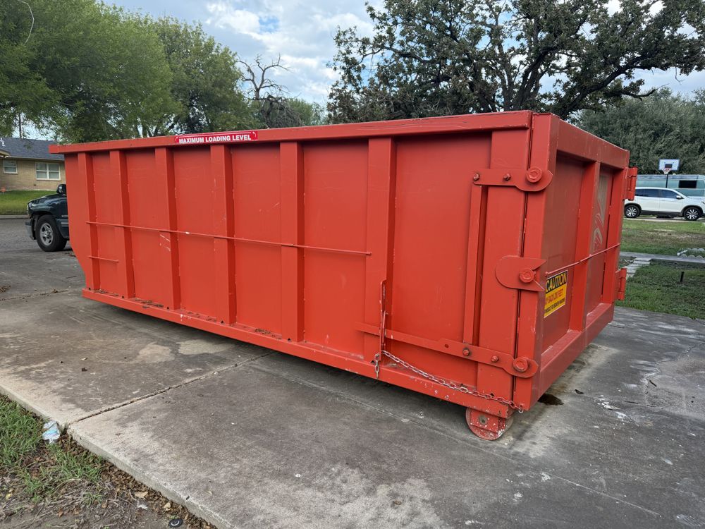 Rockin JL roll off dumpster on a residential driveway